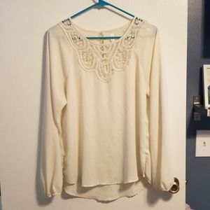 Cream blouse with lace on the top